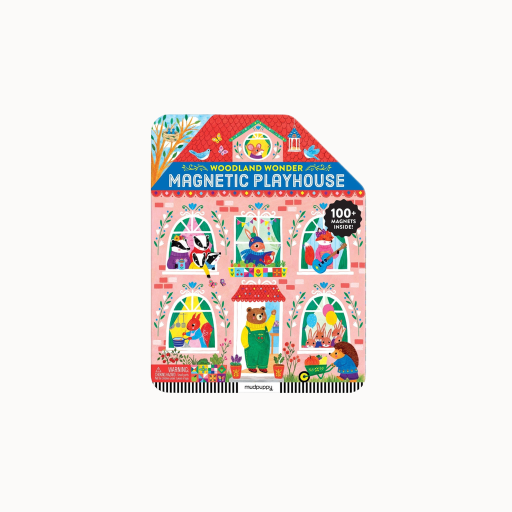 A children's magnetic playset box labeled 'Woodland Wonder 2024 Magnetic Playhouse' on a plain light background. The front shows a pink house illustration with woodland characters in colorful windows and doors, plus a small 'madeiny' mark at the bottom.