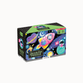 A 100-piece jigsaw puzzle box titled 'Space to the Dream PUZZLE' by Plushpuss, featuring a colorful cartoon space theme with a pink rocket, a blue planet, and a cat astronaut on a black background.