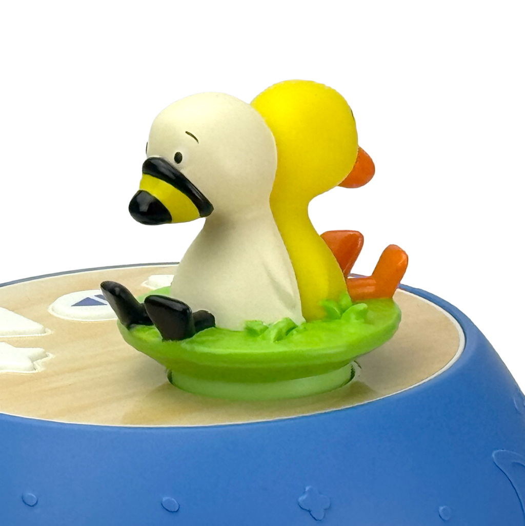Colorful duck-shaped toy with a blue base on a white background