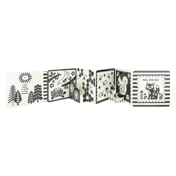 Children's board book with black and white illustrations on a white background