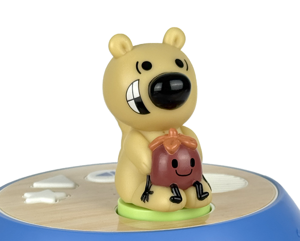 Toy figure of a bear holding a potted plant on a white background