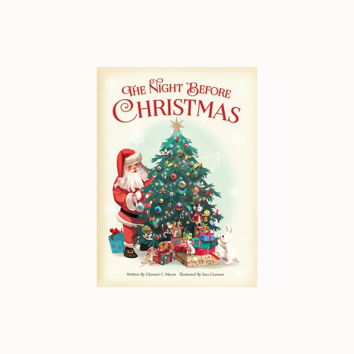 The Night Before Christmas book cover featuring Santa Claus decorating a Christmas tree with gifts and presents underneath, centered on a light cream background.