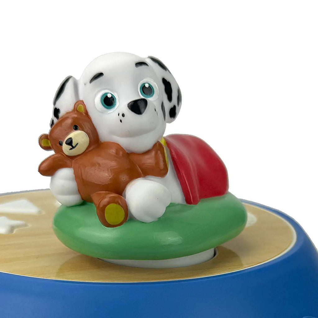 Toy figure of a dalmatian dog with a teddy bear on a white background