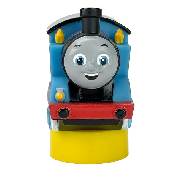 Toy train engine with a smiling face on a white background