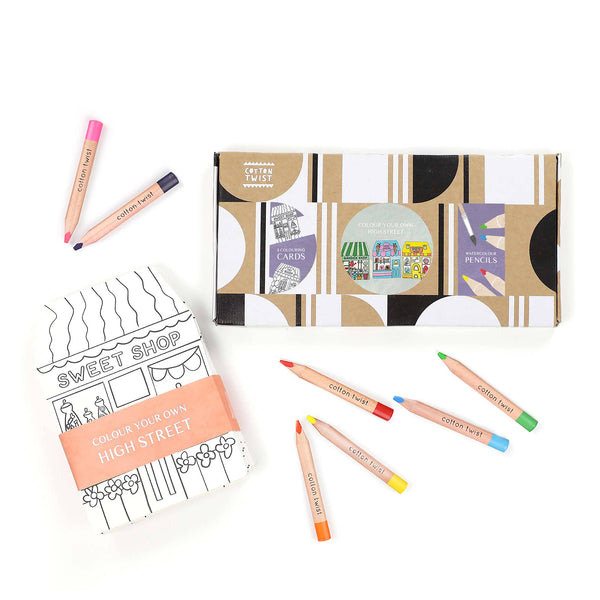 Coloring book and crayons set on a white background