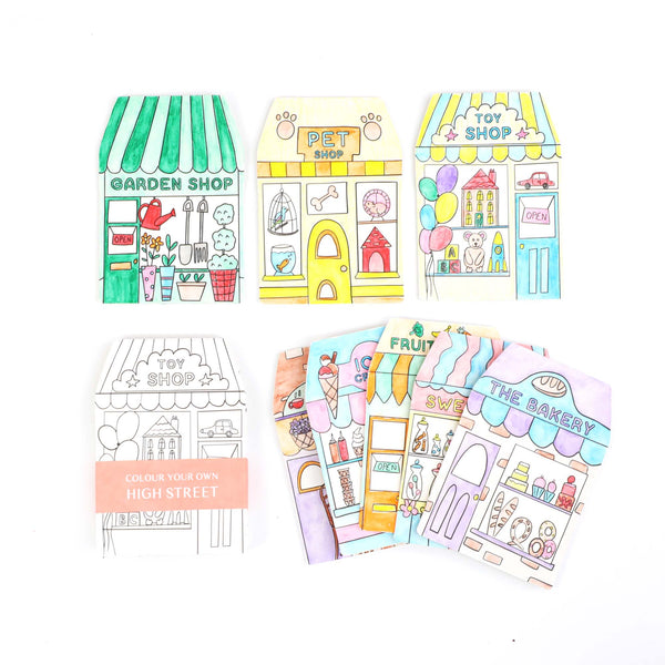 Coloring book pages with illustrations of shops and buildings on a white background