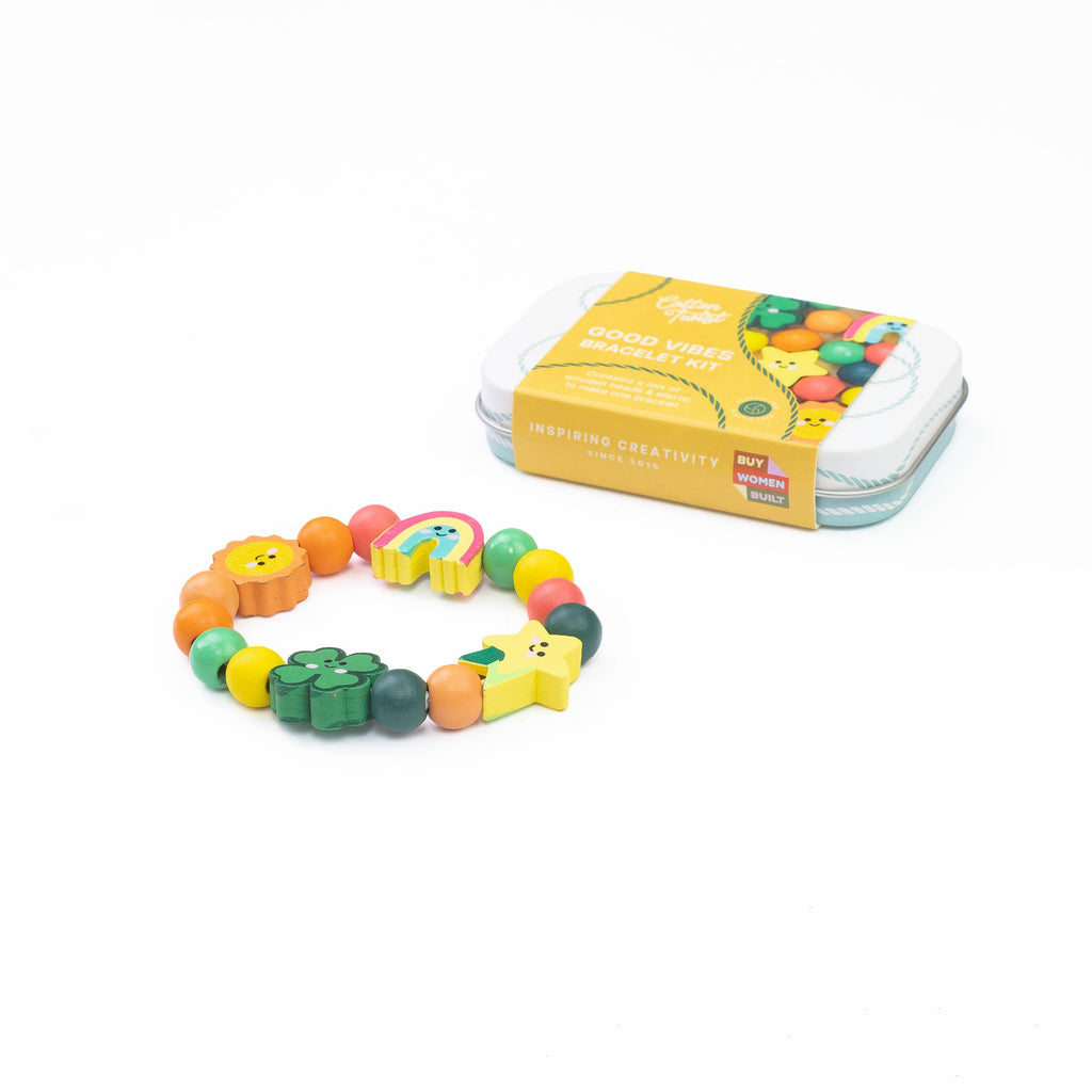 Colorful bracelet with animal charms and packaging on a white background