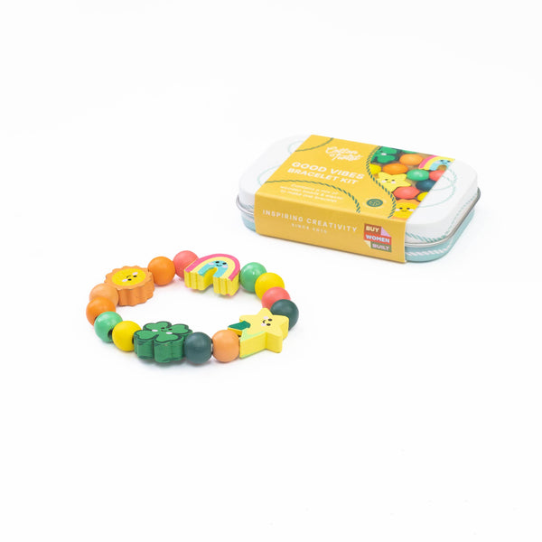 Colorful bracelet with animal charms and packaging on a white background