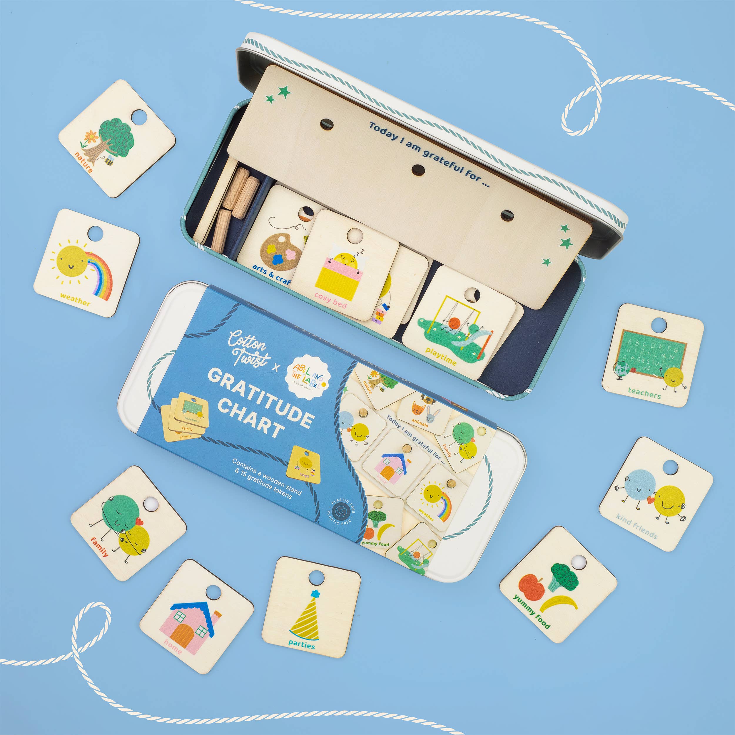 Children's gratitude chart set with cards and a tin on a blue background
