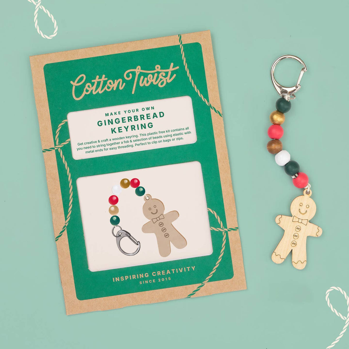 Gingerbread keyring craft kit with packaging on a light green background