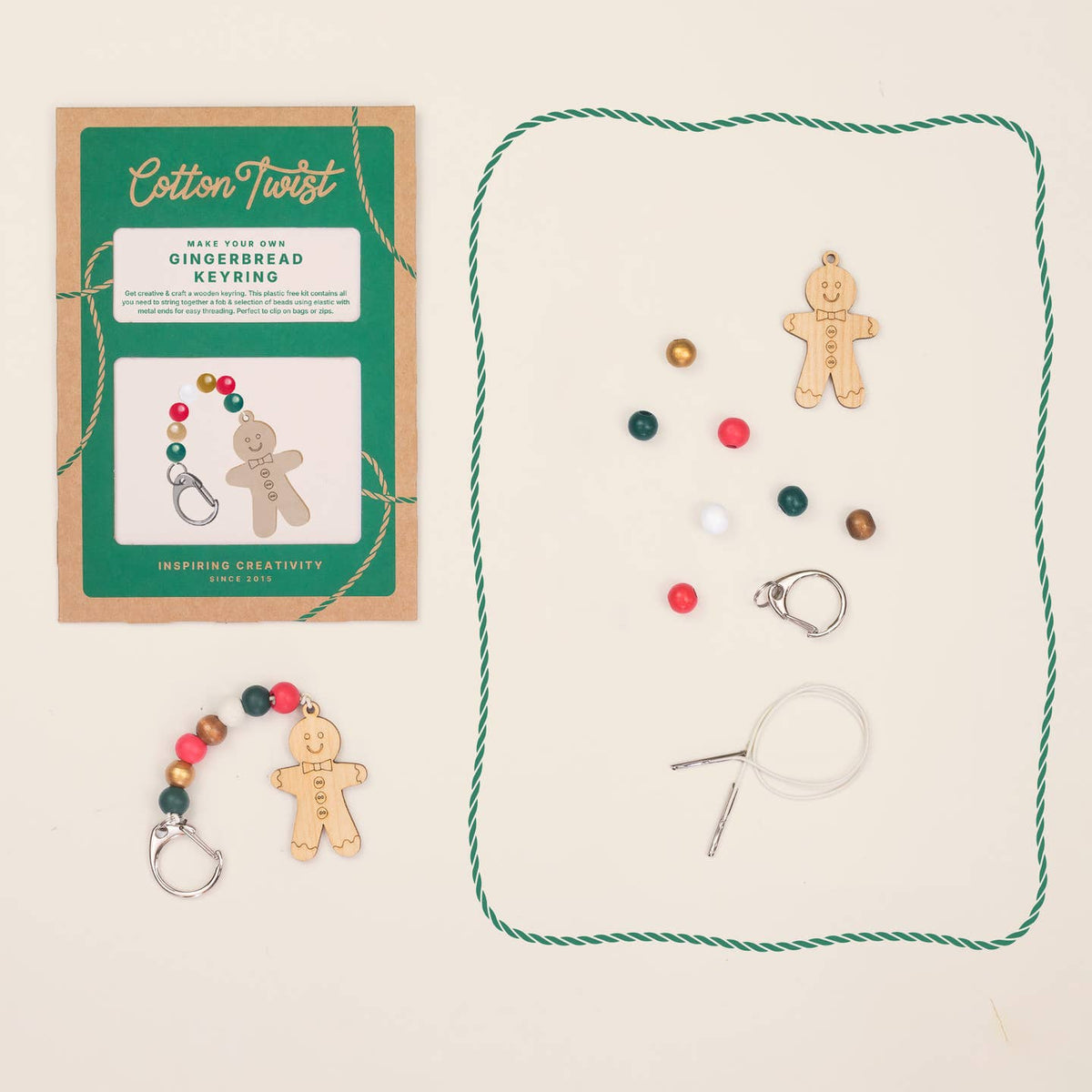 Gingerbread keyring kit with materials and packaging on a beige background