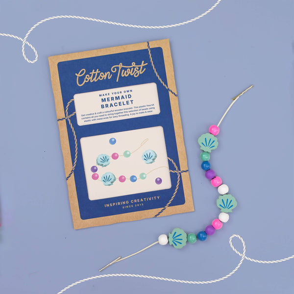 Mermaid bracelet kit with colorful beads and packaging on a blue background