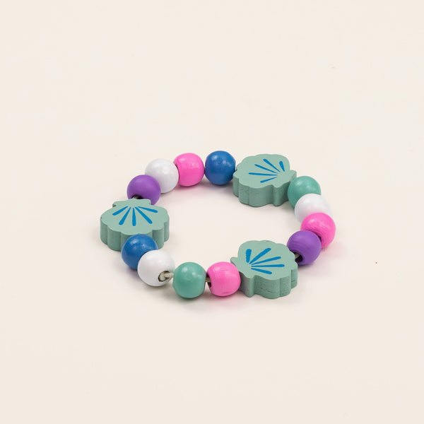 Colorful children's bracelet with floral-shaped beads on a beige background