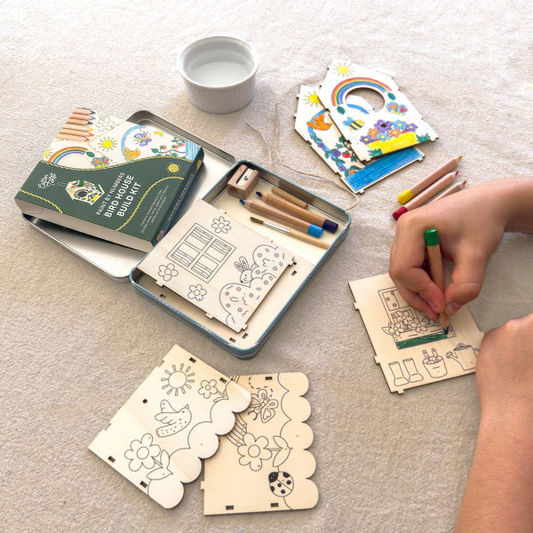 Wooden craft kit with coloring cards and pencils on a table