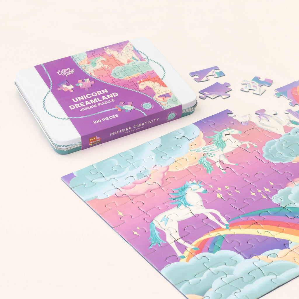 Unicorn-themed puzzle with pieces and packaging on a white background