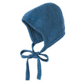 Blue knitted baby bonnet on a white background