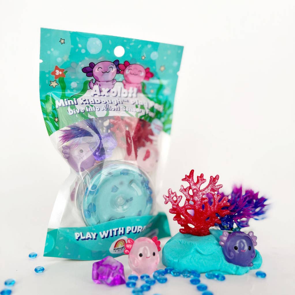 Miniature ocean-themed toys with packaging on a white background