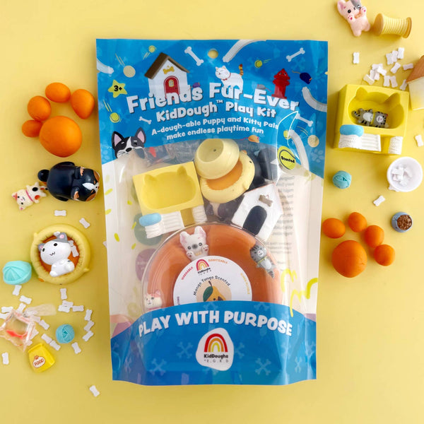 Kid dough play kit packaging with colorful play items on a yellow background