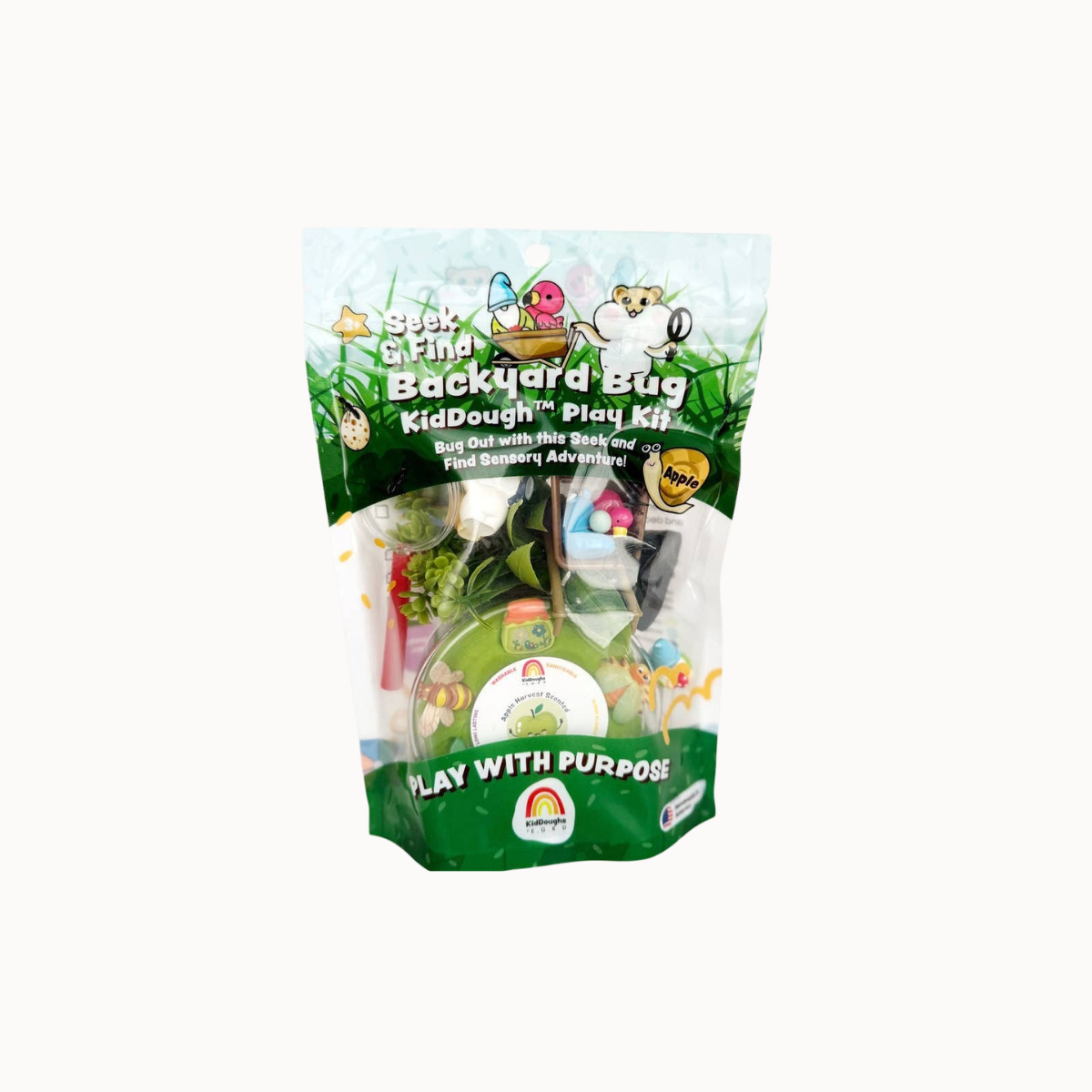 A packaged 'Stick & Fine Backyard Bag KidDough Play Kit' in a clear stand-up pouch with a green and white label, photographed on a plain white background.