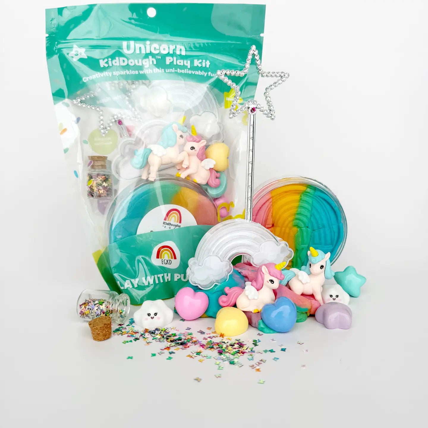 Unicorn-themed kid dough play kit with colorful packaging and toys on a white background