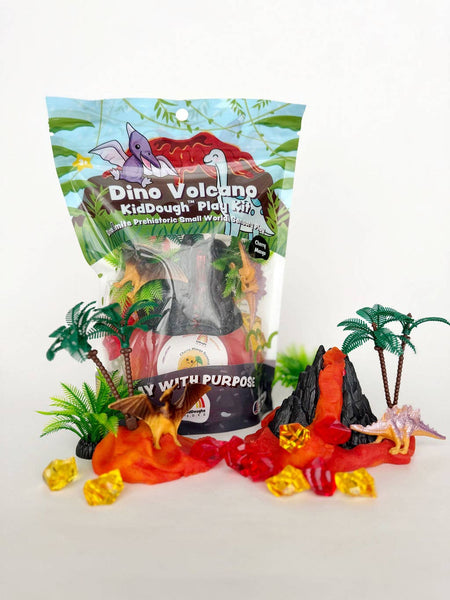 Dino Volcano KidDough Play Kit with volcano model, palm trees, and small world figures on a white background.