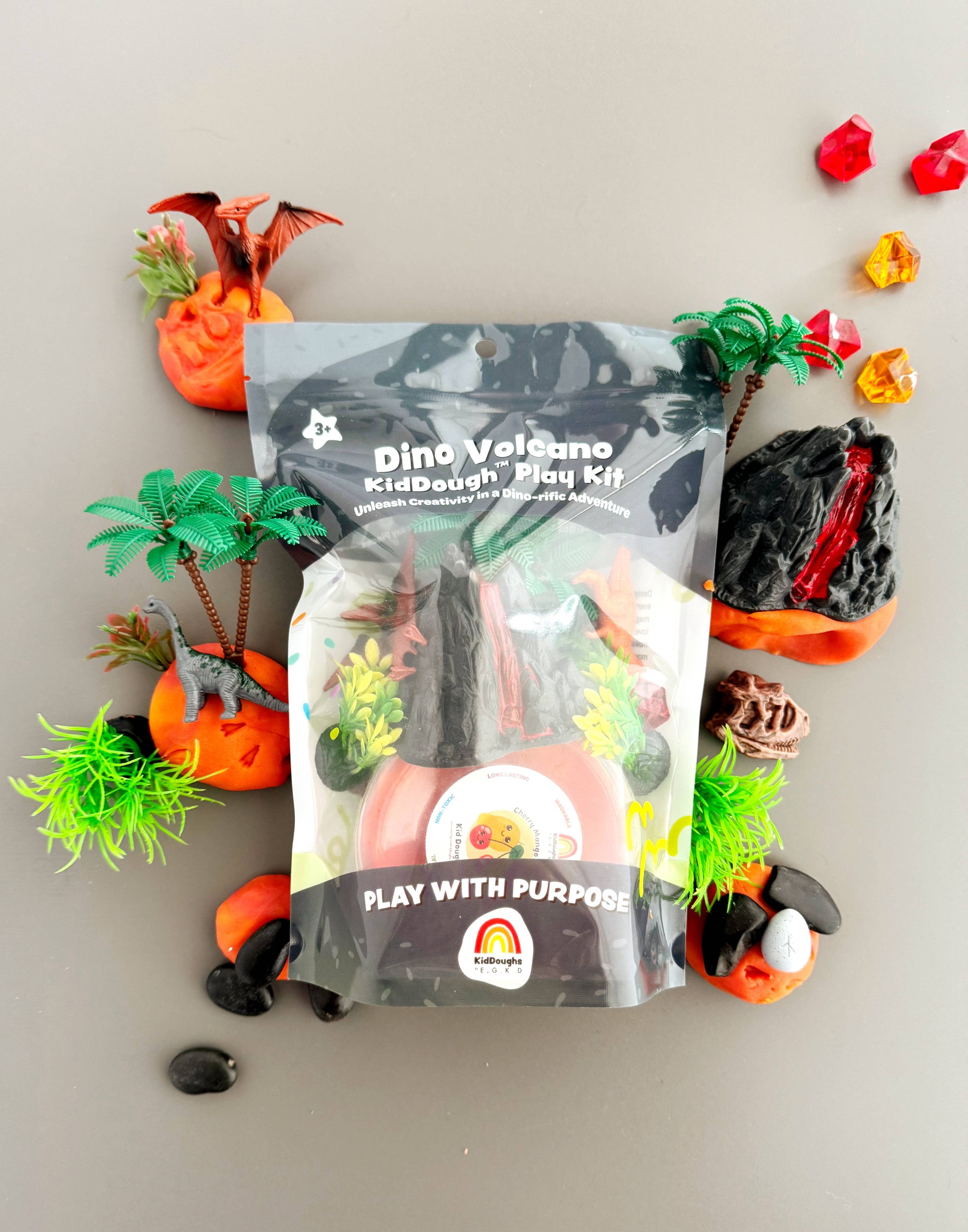 Dino Volcano play dough kit with colorful play dough pieces on a neutral background