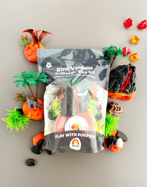 Dino Volcano play dough kit with colorful play dough pieces on a neutral background