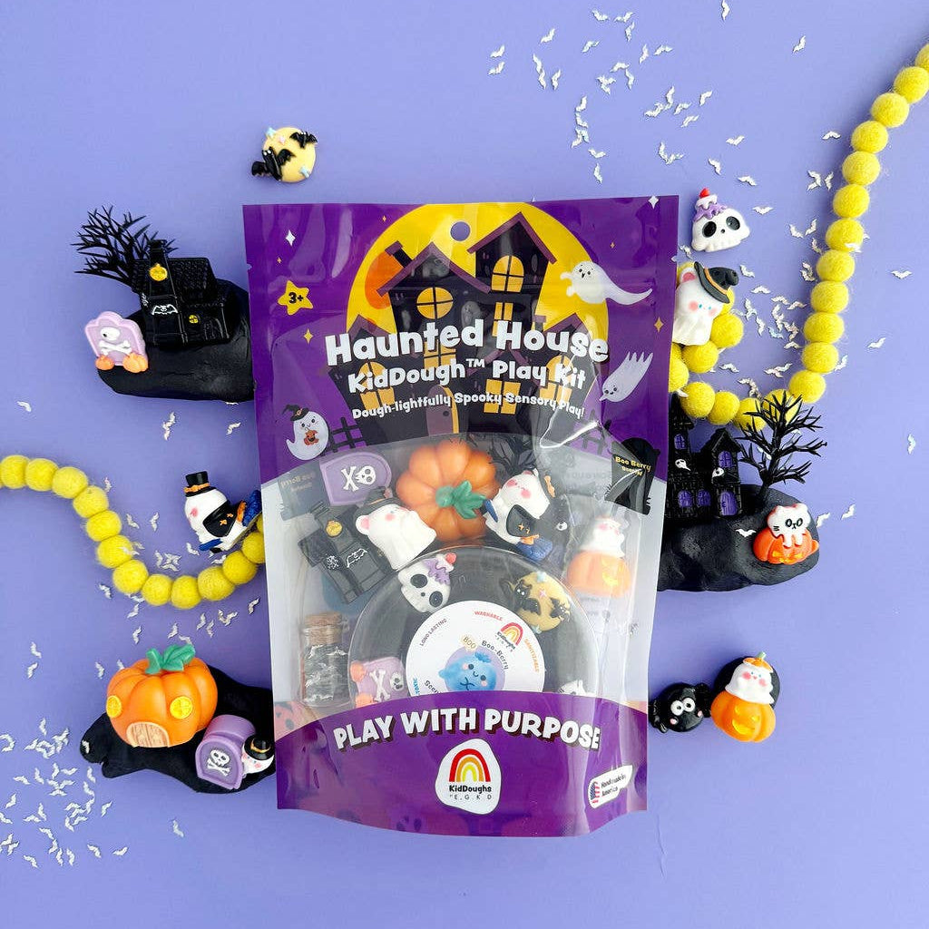 Purple 'Haunted House KidDough Play Kit' packaging with Halloween-themed toys on a purple background.