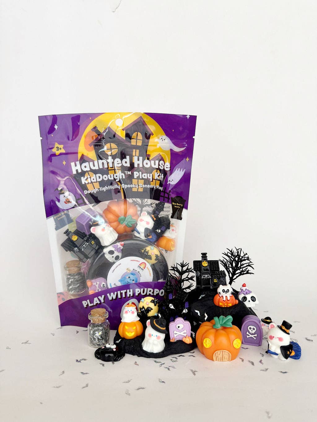 Halloween-themed play set with a purple packaging labeled 'Haunted House Kid Dough Play Kit' on a white background.