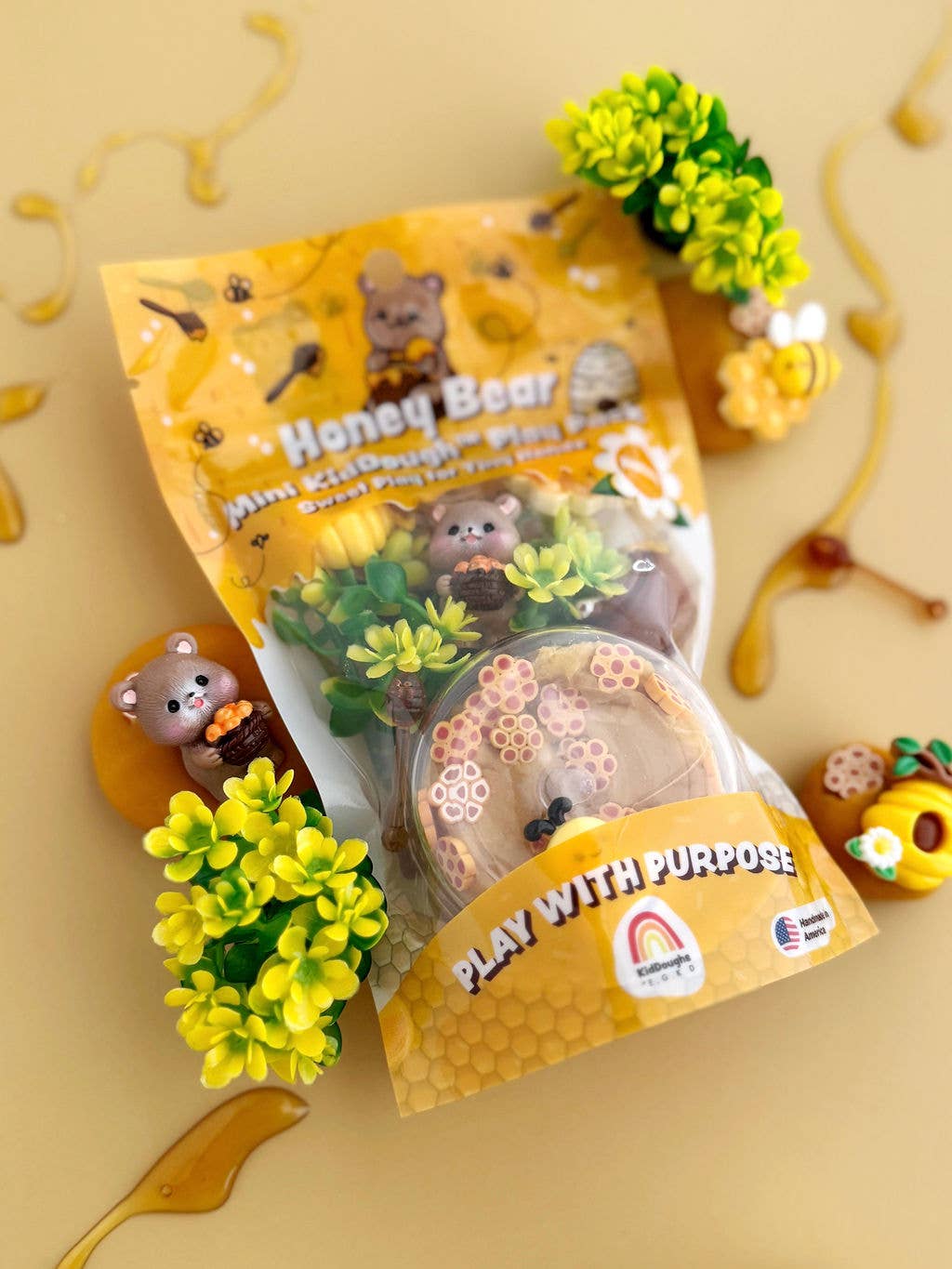 Honey Bear toy packaging with a bear character on a yellow background