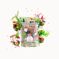 A children's craft playset called 'Mushroom Moshpit' shown in its clear plastic packaging, surrounded by miniature decorative props including small plants, mushrooms, and gnome figures on a plain white background.