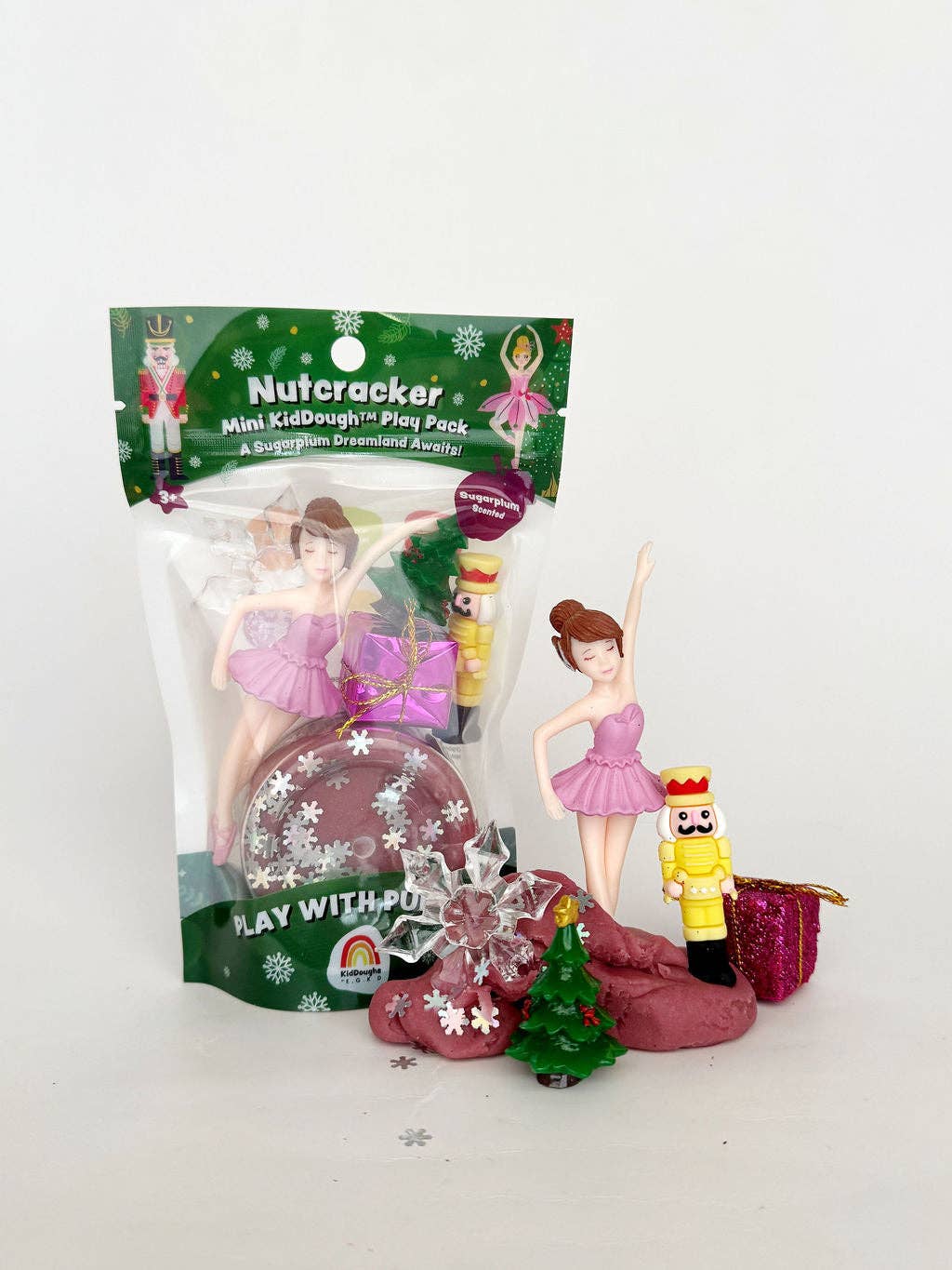 Nutcracker-themed playset with figurines and packaging on a white background