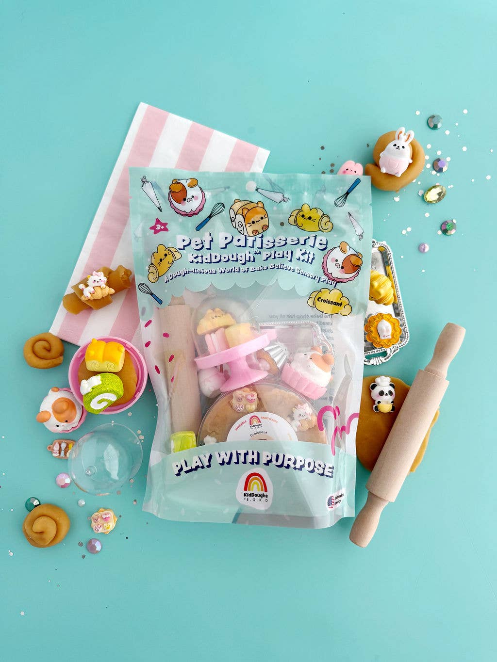 Play dough kit packaging with play dough items on a blue background