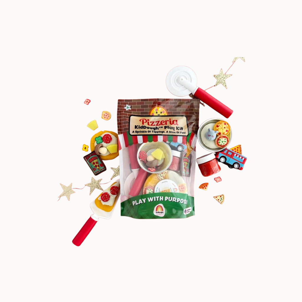 Pizzeria KidDough play kit with toy pizza cutter, rolling pin, and play dough on a white background.