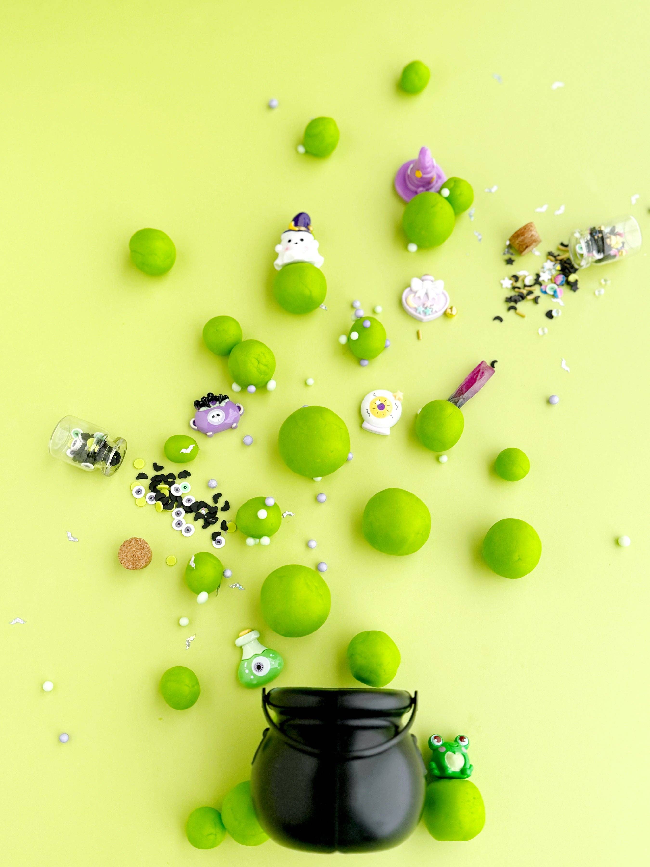 Green spherical objects with decorative elements on a yellow background