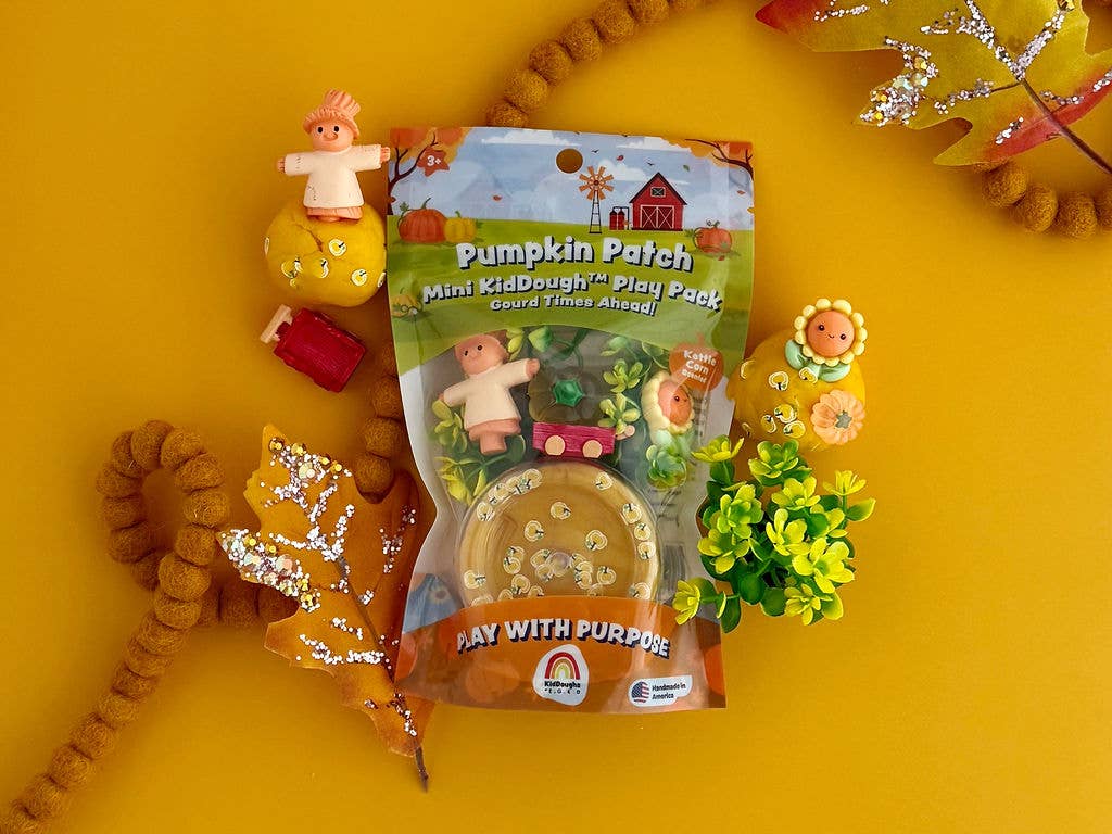 Pumpkin Patch Mini Kidz Play Pack on a yellow background with toys and plants.