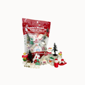 Santa's Workshop Kidnough Play Kit in a red resealable bag with several small Christmas-themed figurines and accessories displayed in front on a white background.