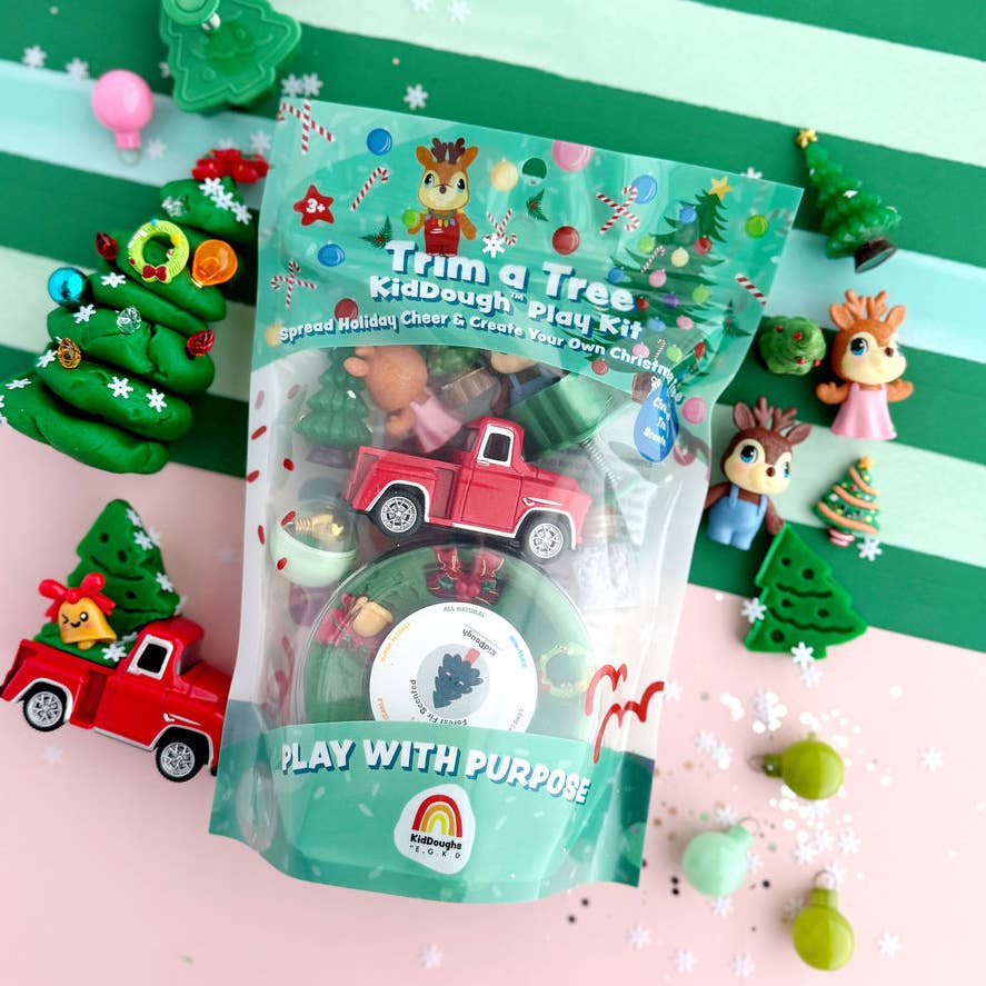 Kidadough 'Trim a Tree' kids play kit with Christmas-themed toys on a colorful background