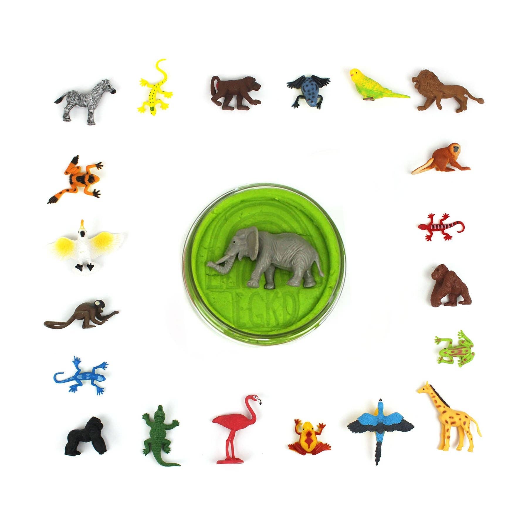 Collection of small animal figurines around a green container with an elephant on a white background