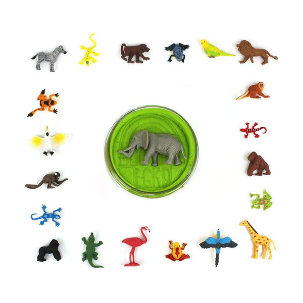 Collection of small animal figurines around a green container with an elephant on a white background