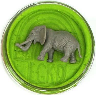 Green dough with a small elephant figurine on top