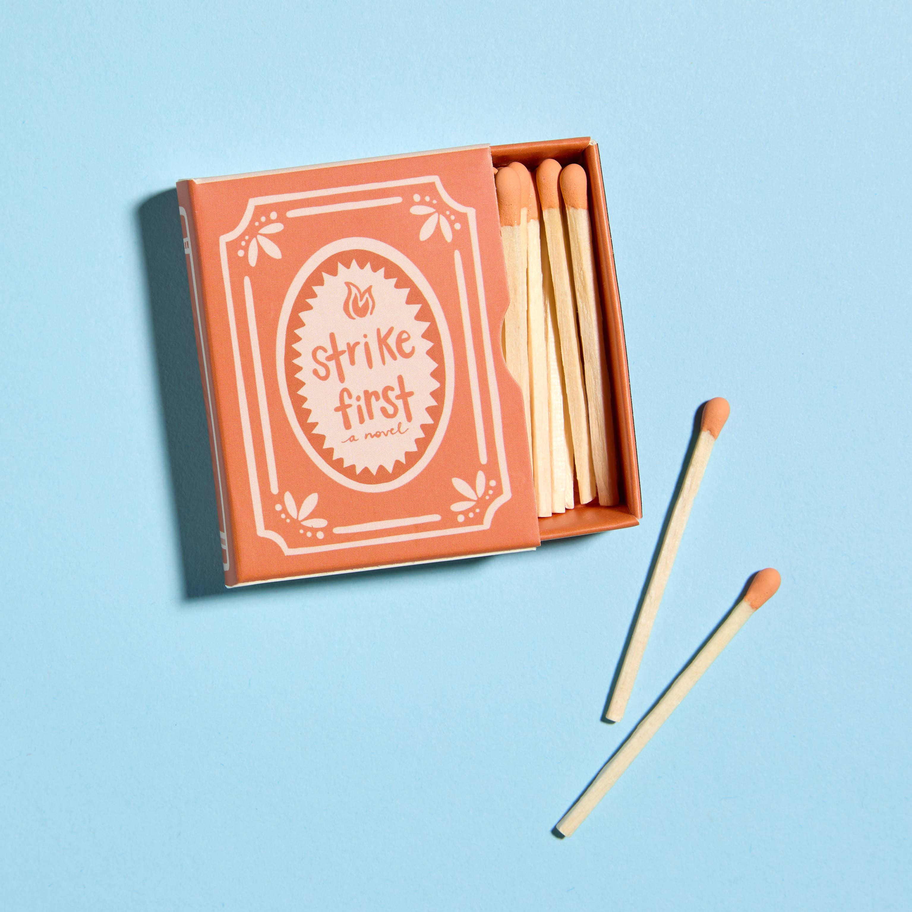 Matches with 'strike first' packaging on a light blue background