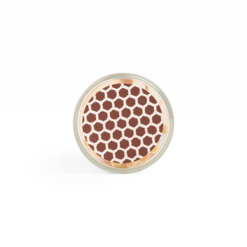 Round container with brown honeycomb pattern on a white background