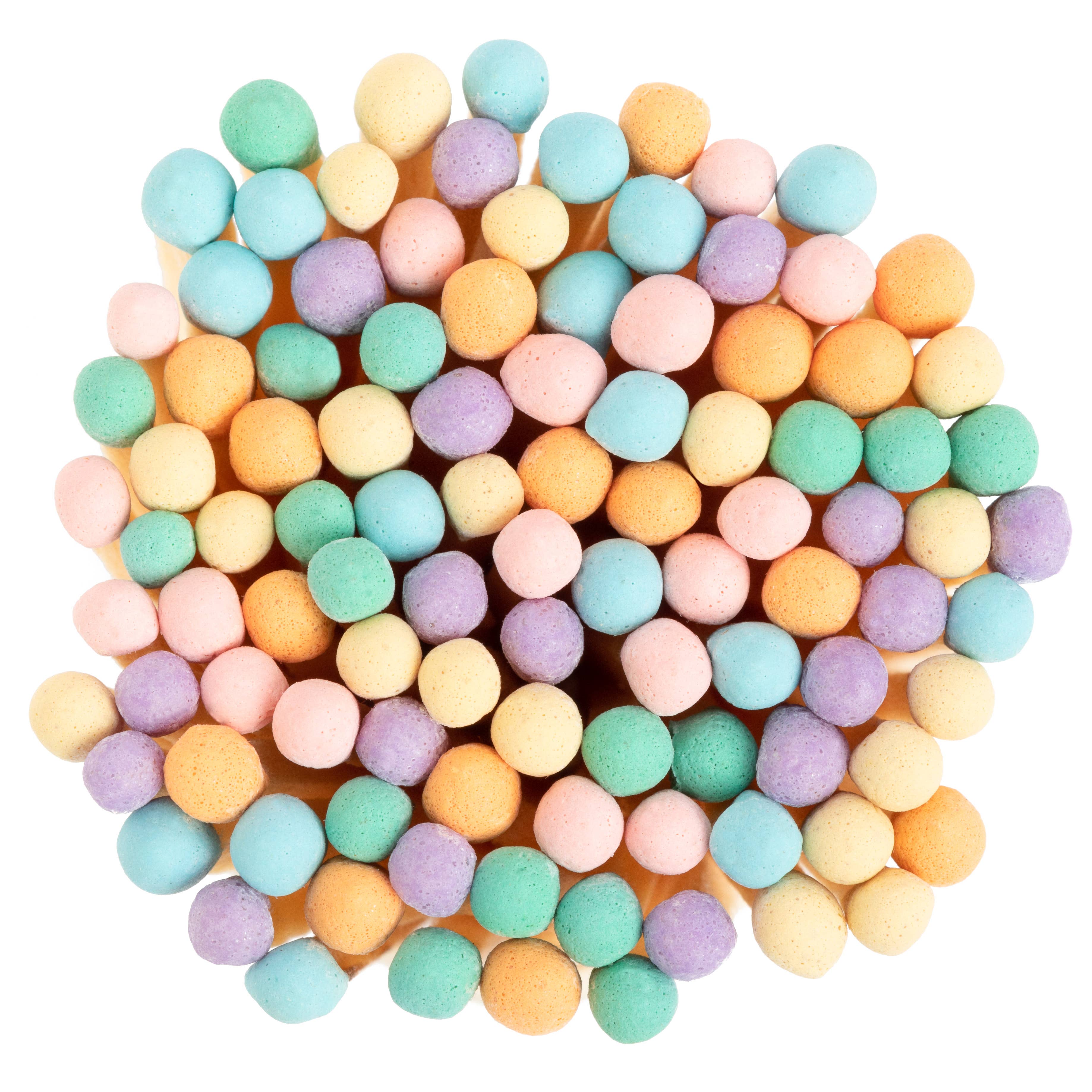 Pastel-colored round candies on a white background