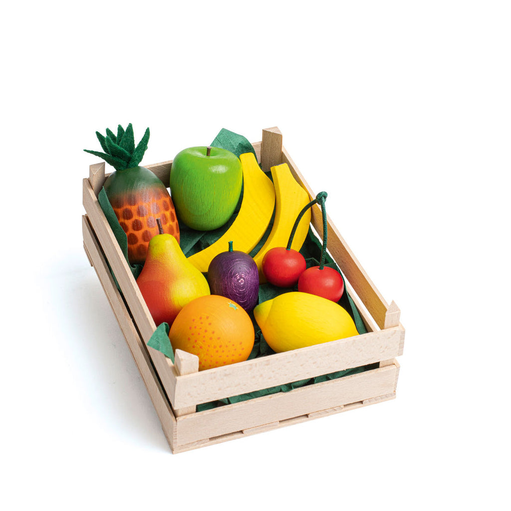 Set of toy fruits in a wooden crate on a white background