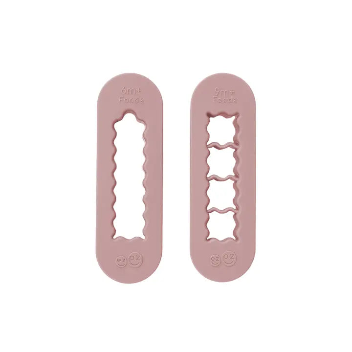 Two pink silicone mold tools on a white background