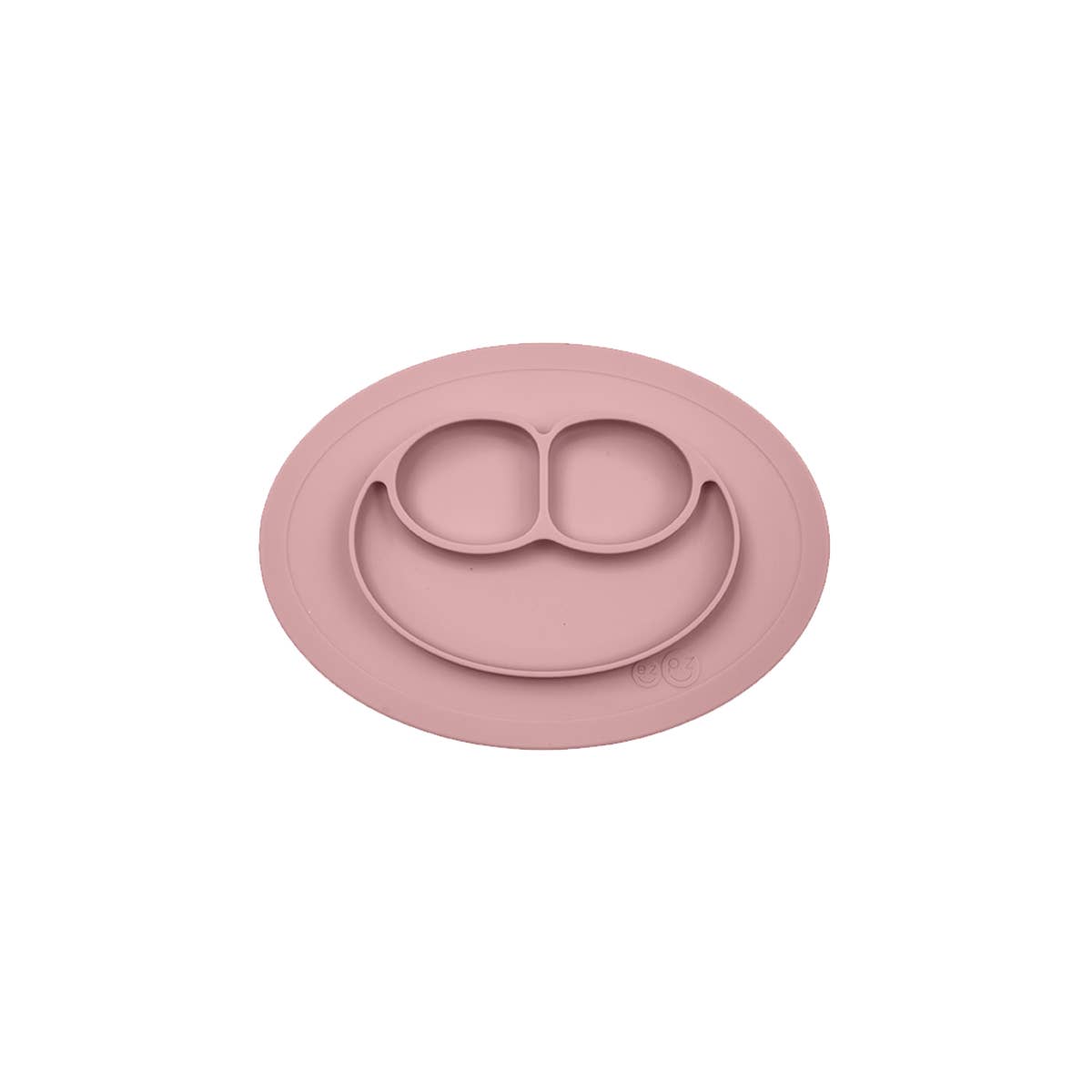 Pink silicone placemat with smiley face design on a white background