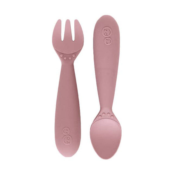Pink fork and spoon set on a white background