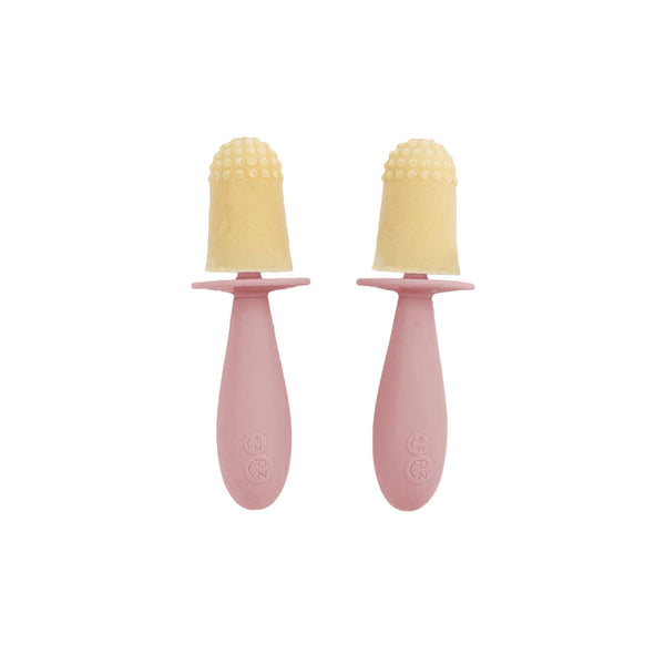 Two pink baby teething toys with yellow silicone nozzles on a white background