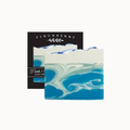 A square artisan soap bar with a blue and white marbled wave pattern, shown in front of its black packaging box labeled 'FINCHBERRY' and 'Fresh i.